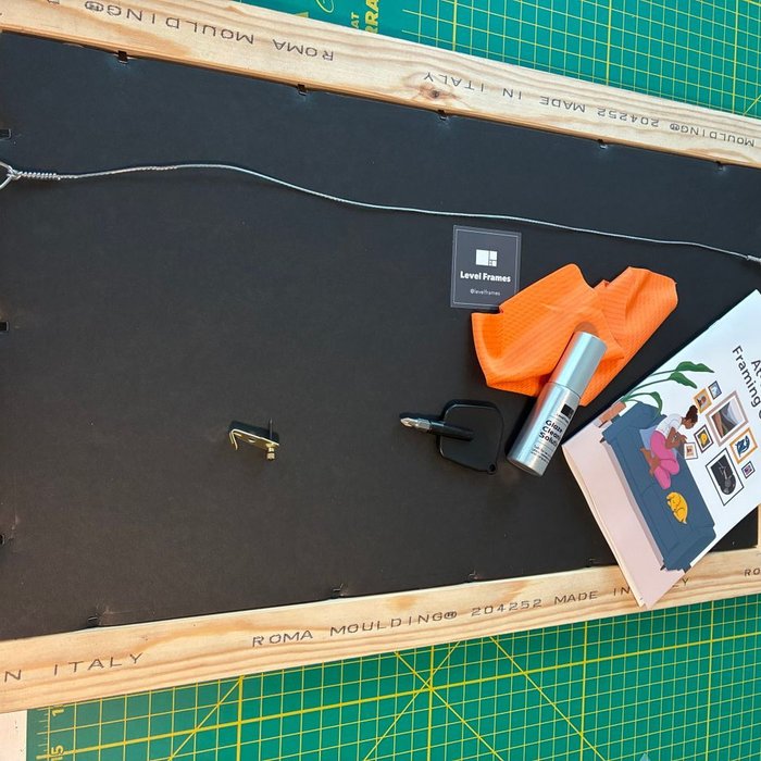 Verified customer review from Debbie: "Very impressed with this frame and how it arrived. It was packaged well, with great care and everything was intact.  The frame itself appears to be very good quality. It came with everything needed to frame and hang picture: instruction booklet, cleaning cloth and spray cleaner, predrilled holes in frame,  assembled wire hanger, hook for wall, bumper dots for corners and a mini screwdriver.  Very impressive!!  I actually found some of the supplies in the box after the fact. I don't think I've received many items/orders containing such a complete wealth of supplies one would need.  Thank you. Very happy."